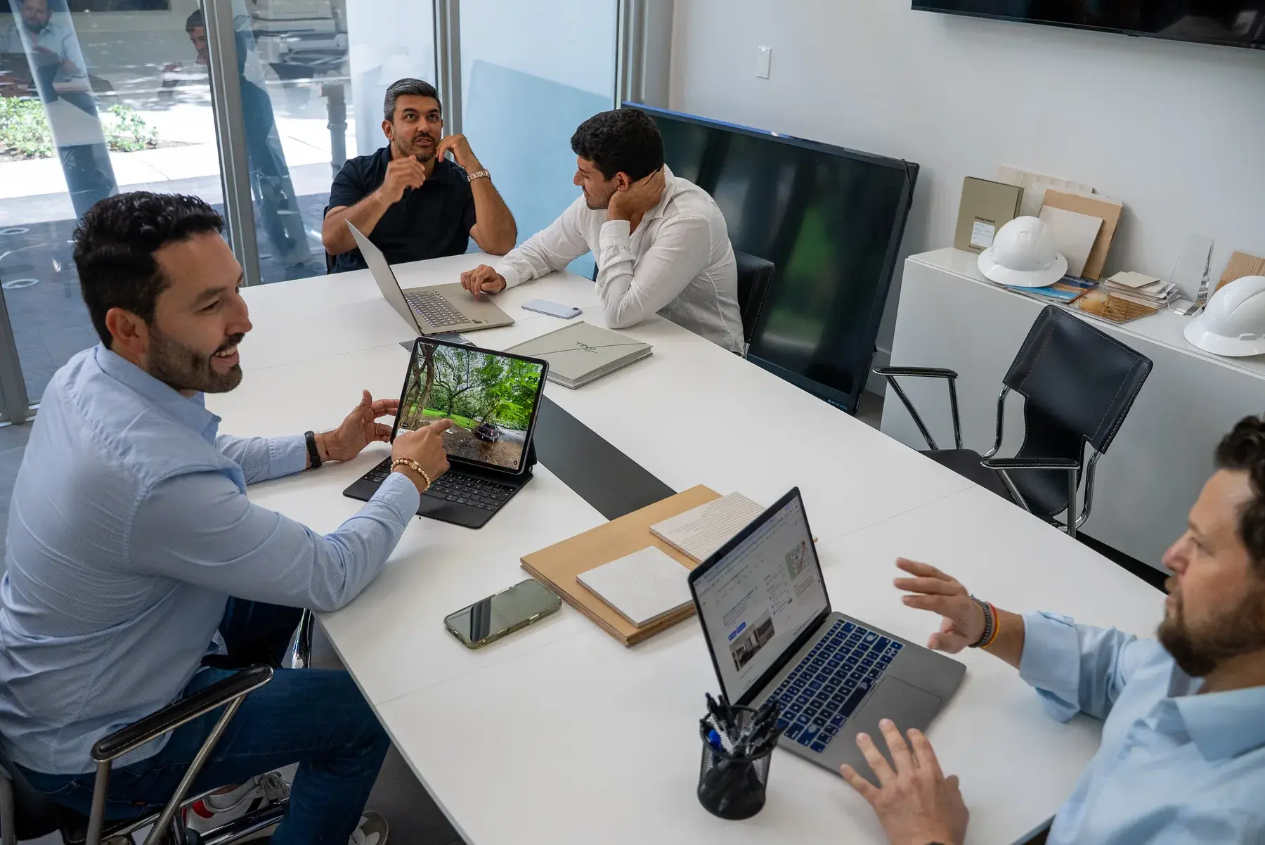 Solano Group team reviewing a project around the conference table